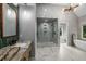 Stunning bathroom featuring double shower, freestanding tub, and granite countertops at 600 Oakmont Hl, Duluth, GA 30097