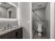 Modern bathroom featuring granite countertop, sleek fixtures, and tiled walk-in shower at 600 Oakmont Hl, Duluth, GA 30097