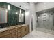 Bathroom with double vanity, walk-in shower, and walk-in closet entrance at 600 Oakmont Hl, Duluth, GA 30097