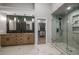 Well-lit bathroom with walk-in shower, double vanity, and ample storage at 600 Oakmont Hl, Duluth, GA 30097