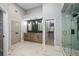 Bathroom with double vanity, walk-in shower, and walk-in closet at 600 Oakmont Hl, Duluth, GA 30097