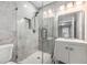 Bathroom featuring walk-in shower with glass doors and a single vanity at 600 Oakmont Hl, Duluth, GA 30097