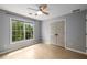 Bedroom with hardwood floors, ceiling fan, and closet at 600 Oakmont Hl, Duluth, GA 30097
