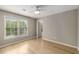 Bedroom with hardwood floors, and a ceiling fan offering natural light at 600 Oakmont Hl, Duluth, GA 30097