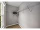 Spacious walk-in closet with wire shelving and a window for natural light at 600 Oakmont Hl, Duluth, GA 30097