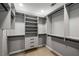Well-organized walk-in closet featuring custom shelving and plenty of storage space at 600 Oakmont Hl, Duluth, GA 30097