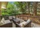 Relaxing outdoor deck with wicker furniture, perfect for entertaining or enjoying nature at 600 Oakmont Hl, Duluth, GA 30097