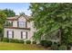 Charming two-story home featuring a well-manicured front yard and a classic design with beautiful landscaping at 600 Oakmont Hl, Duluth, GA 30097