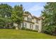 Charming two-story home featuring a well-manicured front yard and a classic design with beautiful landscaping at 600 Oakmont Hl, Duluth, GA 30097