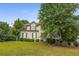 Charming two-story home featuring a well-manicured front yard and a classic design with beautiful landscaping at 600 Oakmont Hl, Duluth, GA 30097