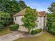 Charming stucco home with a two-car garage, complemented by mature landscaping and a paved driveway at 600 Oakmont Hl, Duluth, GA 30097