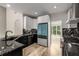 Modern kitchen with granite countertops, stainless appliances, hardwood floors, and large windows at 600 Oakmont Hl, Duluth, GA 30097