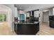 Open concept kitchen with modern appliances, granite countertops, and a kitchen island at 600 Oakmont Hl, Duluth, GA 30097