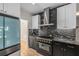 New kitchen features modern black stainless appliances and granite countertops and white cabinets at 600 Oakmont Hl, Duluth, GA 30097