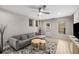 Comfortable living area featuring a sectional sofa, area rug, and a view to the home's exterior at 600 Oakmont Hl, Duluth, GA 30097