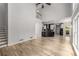 Spacious living room with hardwood floors and open access to the kitchen and staircase at 600 Oakmont Hl, Duluth, GA 30097