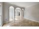 Bright and large living area featuring beautiful hardwood floors, white trim and pillars at 600 Oakmont Hl, Duluth, GA 30097