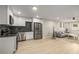 Open living space with a modern kitchen, stainless appliances, and a comfortable sitting area at 600 Oakmont Hl, Duluth, GA 30097