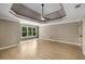 Spacious main bedroom with hardwood floors, trey ceiling, and windows overlooking the yard at 600 Oakmont Hl, Duluth, GA 30097