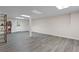 Finished basement with gray vinyl floors and a walkout door at 739 Dushea Nw Ct, Kennesaw, GA 30144
