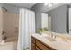 Bathroom boasts a shower/tub combo, vanity, and a large mirror at 739 Dushea Nw Ct, Kennesaw, GA 30144