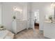 Bathroom features tiled floors, double vanity, and door to bedroom at 739 Dushea Nw Ct, Kennesaw, GA 30144