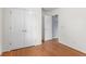 Hallway with hardwood floors, closet, and doorways to other rooms at 739 Dushea Nw Ct, Kennesaw, GA 30144