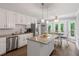 Bright kitchen with granite countertops, stainless steel appliances, and a cozy breakfast nook at 739 Dushea Nw Ct, Kennesaw, GA 30144