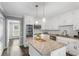Modern kitchen with white cabinets, granite countertops, and stainless steel appliances at 739 Dushea Nw Ct, Kennesaw, GA 30144
