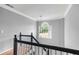 Staircase with open window and natural light at 739 Dushea Nw Ct, Kennesaw, GA 30144