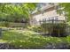 Expansive backyard with lawn, deck, landscaping, and privacy fence creates a relaxing outdoor oasis at 1064 Saint James Xing, Brookhaven, GA 30319