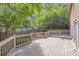 Spacious wood deck is perfect for entertaining, overlooks a private backyard, and is surrounded by lush landscaping at 1064 Saint James Xing, Brookhaven, GA 30319