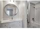 Bathroom boasts a tub/shower with subway tile and an updated vanity with marble countertop at 1064 Saint James Xing, Brookhaven, GA 30319
