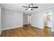 This bedroom features beautiful hardwood flooring, neutral paint, and modern trim at 1064 Saint James Xing, Brookhaven, GA 30319