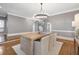 Bright dining room with hardwood floors, a statement chandelier, and space for entertaining at 1064 Saint James Xing, Brookhaven, GA 30319