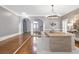 Elegant dining area with hardwood floors, arched doorway, and stylish decor at 1064 Saint James Xing, Brookhaven, GA 30319
