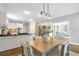 Kitchen features modern lighting, stainless appliances, and an open layout flowing into other spaces at 1064 Saint James Xing, Brookhaven, GA 30319