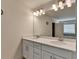 Bright bathroom featuring a double vanity with modern fixtures and a large mirror enhancing the space at 1200 Bar Harbor Pl, Lawrenceville, GA 30044