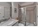 Cozy bathroom featuring a shower with glass sliding doors and modern vanity at 1200 Bar Harbor Pl, Lawrenceville, GA 30044