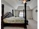 Spacious bedroom features a four-poster bed, tray ceiling, and neutral tones at 1200 Bar Harbor Pl, Lawrenceville, GA 30044