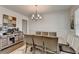 Stylish dining room with sleek decor, wainscoting, and ample space for entertaining at 1200 Bar Harbor Pl, Lawrenceville, GA 30044