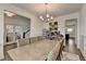 Spacious dining room featuring elegant wainscoting and views of other rooms at 1200 Bar Harbor Pl, Lawrenceville, GA 30044