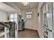 Bright foyer with hardwood floors, elegant trim, and a view of the dining room and staircase at 1200 Bar Harbor Pl, Lawrenceville, GA 30044