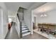 Hallway with hardwood floors leading to a dining room and living room, showcasing an open floor plan at 1200 Bar Harbor Pl, Lawrenceville, GA 30044