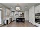 White kitchen featuring an island with seating and stainless steel appliances at 1200 Bar Harbor Pl, Lawrenceville, GA 30044