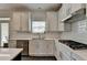 This well-appointed kitchen features stainless steel appliances, white cabinets, and subway tile backsplash at 1200 Bar Harbor Pl, Lawrenceville, GA 30044