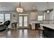 Open-concept kitchen features white cabinets, stainless steel appliances, and hardwood floors, perfect for modern living at 1200 Bar Harbor Pl, Lawrenceville, GA 30044