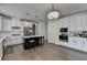 White kitchen featuring an island with seating and stainless steel appliances at 1200 Bar Harbor Pl, Lawrenceville, GA 30044