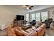 Bright living room with hardwood floors, lots of windows, and comfortable seating arrangement at 1200 Bar Harbor Pl, Lawrenceville, GA 30044