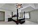 Spacious main bedroom featuring tray ceilings, large windows, and elegant furniture, offering comfort and style at 1200 Bar Harbor Pl, Lawrenceville, GA 30044